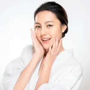 Woman in a robe smiling
