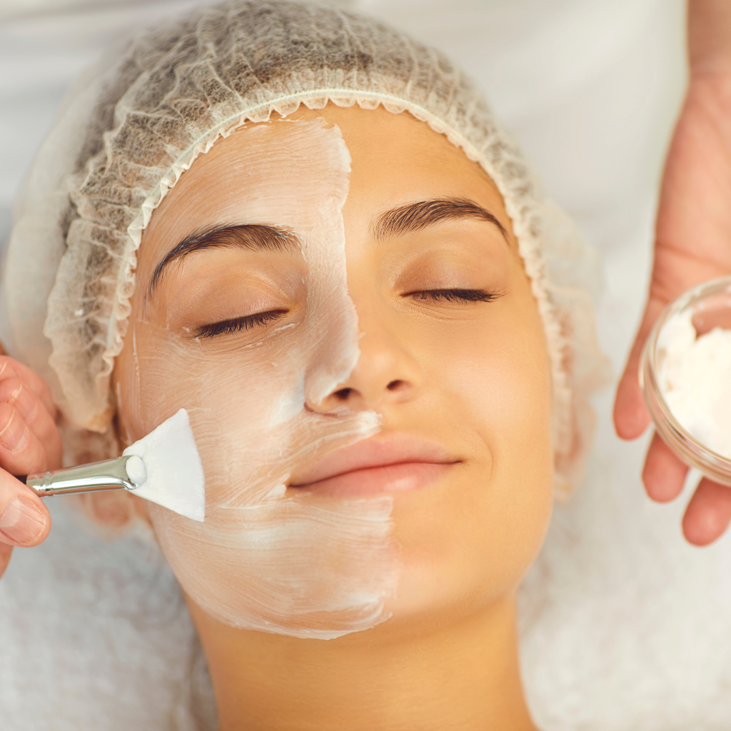 A woman receiving a facial treatment at a spa
